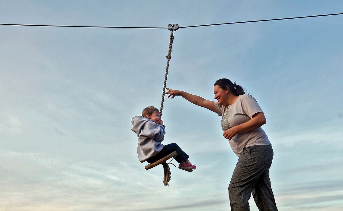 Feature - 3rd placeBree Saunders of Delaware gives daughter Etta Saunders a push on the zip line in the new children's play area in Glacier Ridge Metro Park near Plain City.(Eric Albrecht / The Columbus Dispatch)